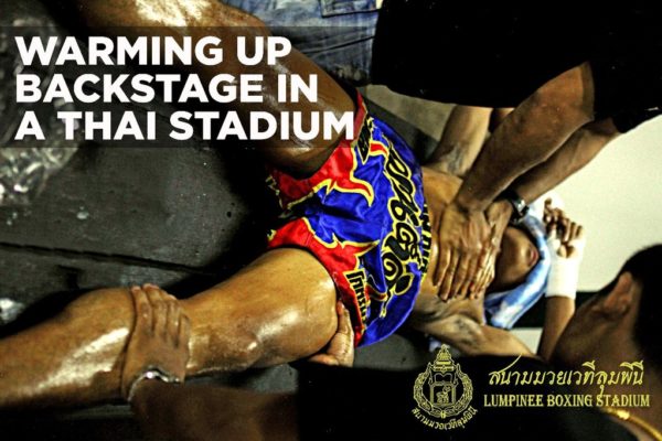 Photo of Boxer being massaged at Lumpinee Stadium Bangkok, Thailand by Jacob Klensin